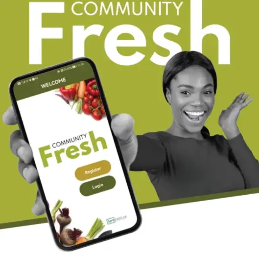 Community Fresh app shown on a phone held by a smiling woman